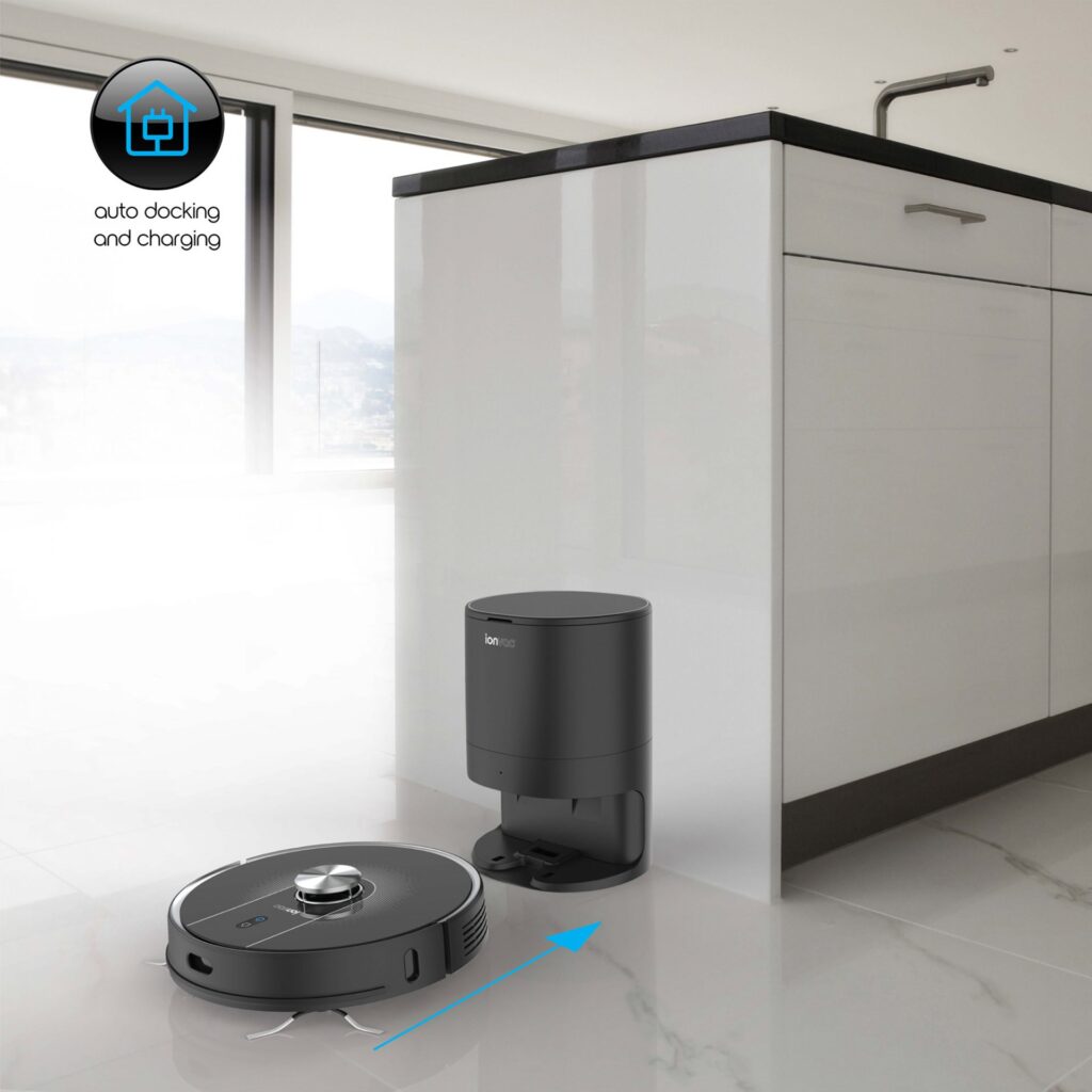 The Optimax360 automatically returns to its charging dock after thoroughly cleaning a kitchen floor.