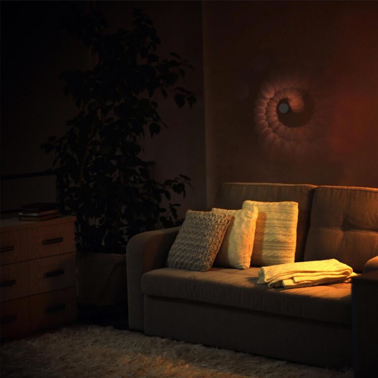 A quaint living room is lit up with warm light by the tzumi Spiral Wall Mount for an unparalleled cozy vibe on a cold night.