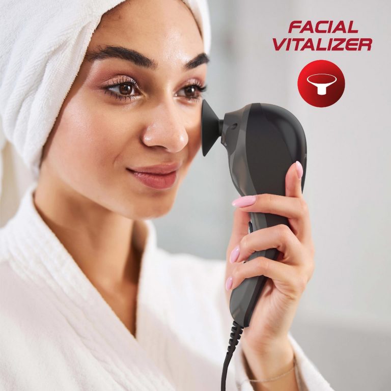 Woman uses the Facial massage attachment on her cheek to further vitalize her muscles after taking a nice hot shower.