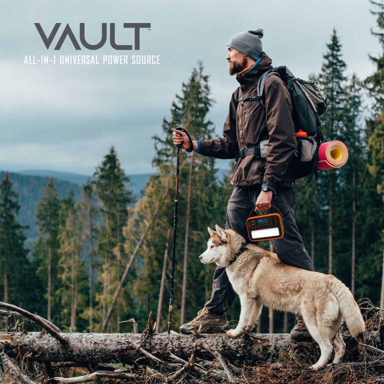 A man and his dog are more prepared than ever to brave the wilderness with the tzumi Vault Power Station on their side.