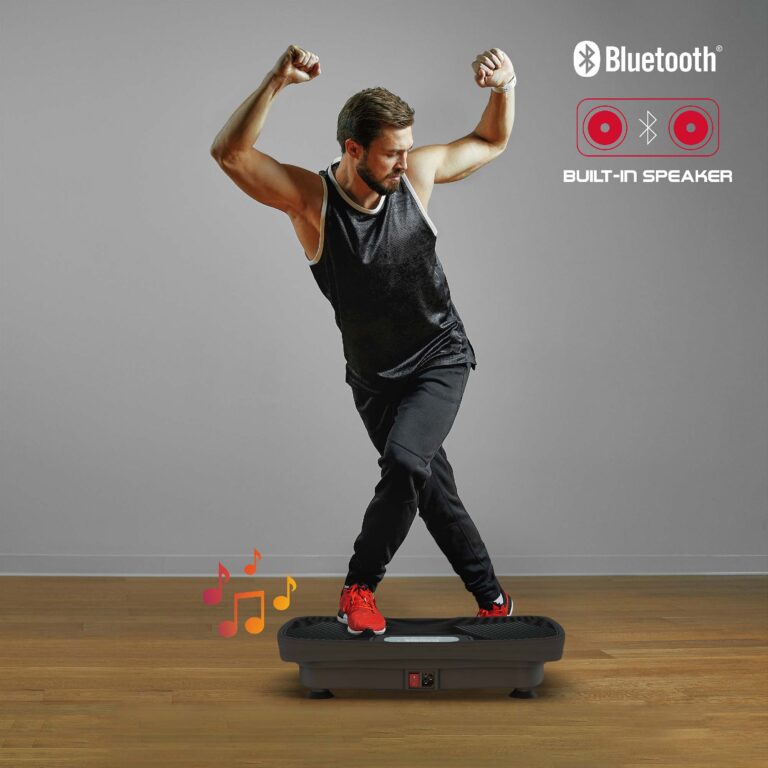 A man working out on the PROfit Vibration Board at home as his favorite music plays through the built-in Bluetooth speaker.